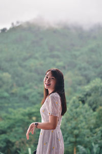 Young woman standing on a land