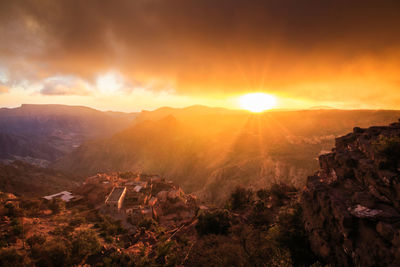 Scenic view of mountains against sky during sunset