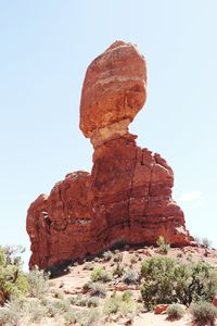 Low angle view of rock formation against sky