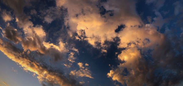 Low angle view of dramatic sky during sunset