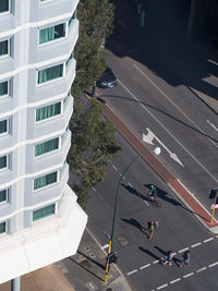 High angle view of people walking on road