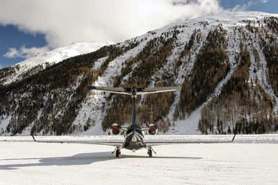 Private jets and aircrafts in the airport of engadine st moritz in winter time