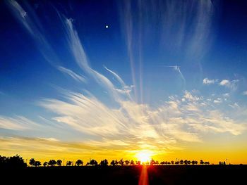 Scenic view of silhouette landscape against sky during sunset