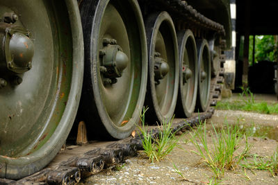 Close-up of old machinery on field