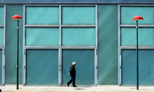 Full length of man walking in city