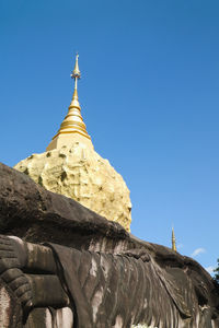 Low angle view of a building against clear blue sky