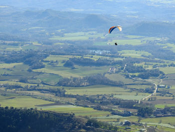 Aerial view of person flying over landscape