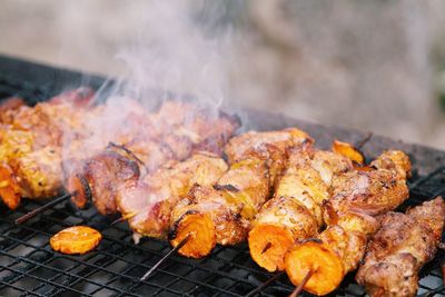 Close-up of meat on barbecue grill