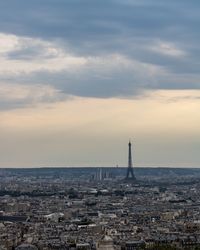 View of buildings against cloudy sky