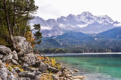 Scenic view of lake and mountains against sky