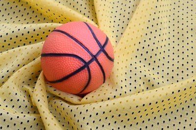 Directly above shot of basketball and textile