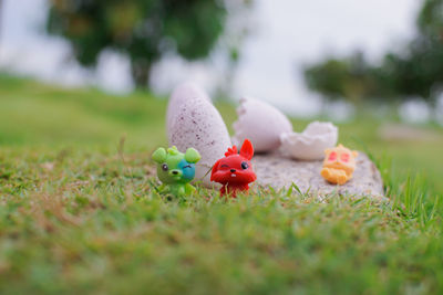Close-up of small stuffed toy on field