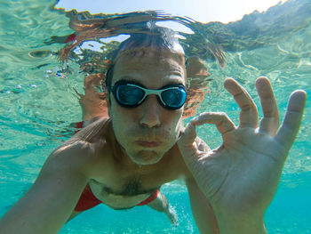 Portrait of man swimming in sea