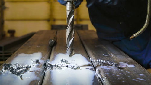 Close-up of man working on table