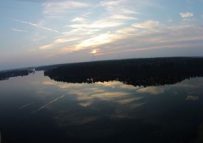 Scenic view of lake at sunset