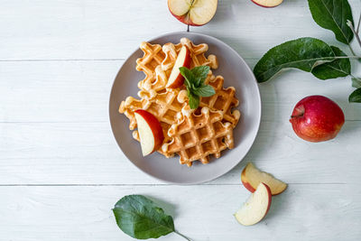 Waffles with apples on a plate