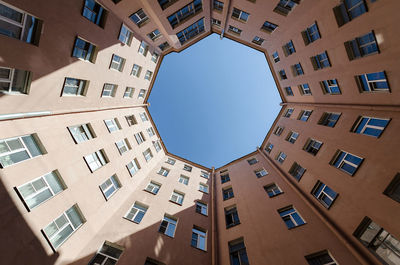 Octagon shape house courtyard. bottom view octagon building in saint petersburg