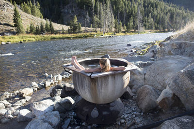 A woman enjoying a dip in the hot springs, idaho