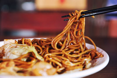 Close-up of noodles in plate on table