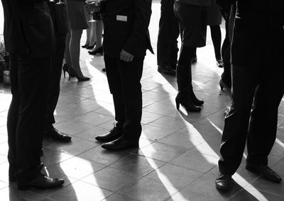 Low section of people standing on floor
