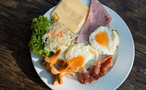 High angle view of breakfast on wooden table