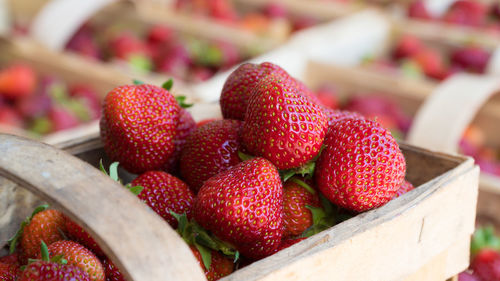 Heap of strawberries in wooden container