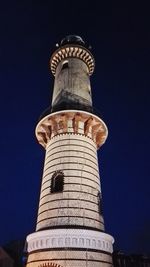 Low angle view of tower against blue sky