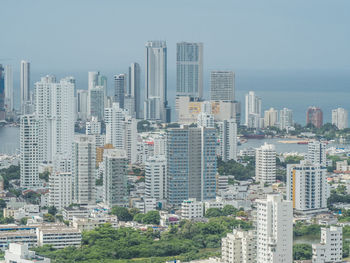 High angle view of buildings in city against sky
