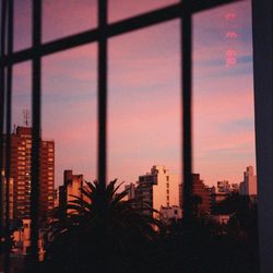 Silhouette of building against sky at sunset