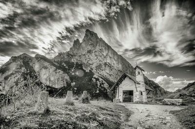 Houses against mountain range