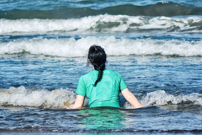 Rear view of man on beach