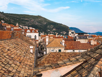 Houses in town against sky