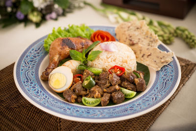 High angle view of meal served in plate at table