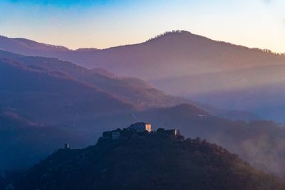 Scenic view of mountains against sky during sunset