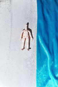 High angle view of siblings walking on swimming pool