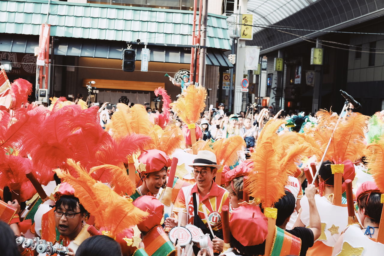 crowd, group of people, large group of people, real people, celebration, architecture, traditional clothing, built structure, men, lifestyles, arts culture and entertainment, city, women, clothing, day, event, traditional festival, togetherness, festival, outdoors, traditional ceremony, carnival - celebration event, traditional dancing