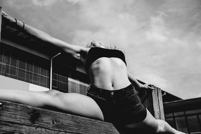 Midsection of woman against sky