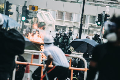 Crowd of people fighting with police during riot