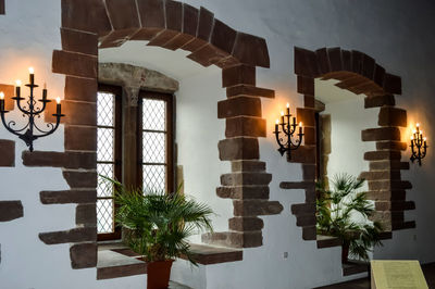 Low angle view of illuminated lights hanging in building