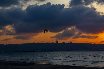 Scenic view of beach against sky during sunset