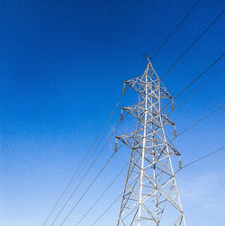 Low angle view of tree against blue sky