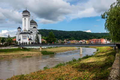 View of buildings against cloudy sky