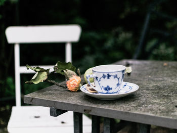 Close-up of coffee cup and fruits on table