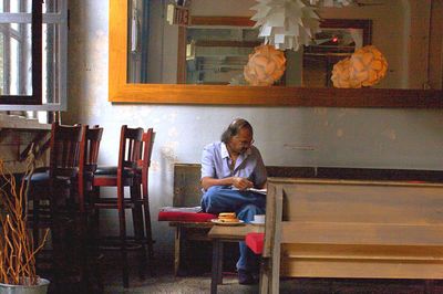 Woman sitting on chair at table