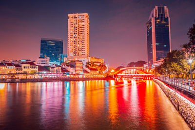 Illuminated buildings at waterfront