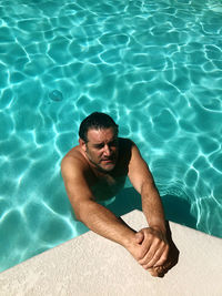 High angle view of man swimming in pool