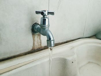 Close-up of faucet in bathroom