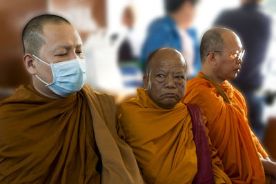 Portrait of friends standing at temple