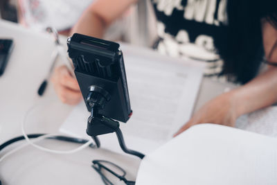 Midsection of man using mobile phone