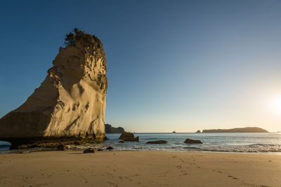 Scenic view of beach against clear sky